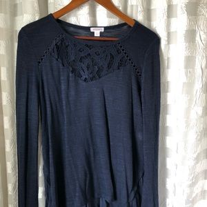 Navy xhilaration sweater with ruffled back.